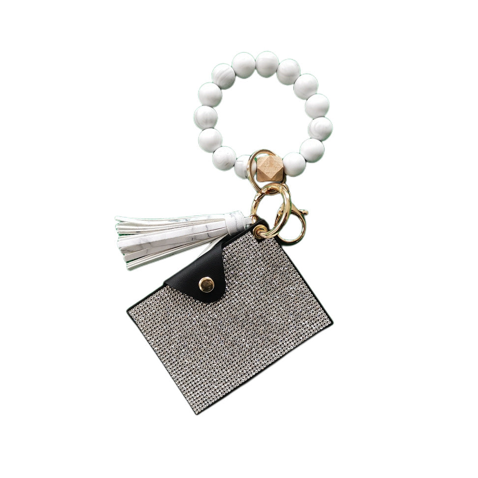 Pulsera de cuentas de silicona con borla y letra, y bolsa de diamantes de imitación