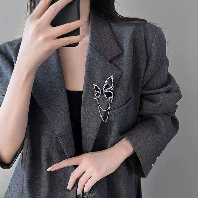 Broche con borlas de mariposa negro para mujer