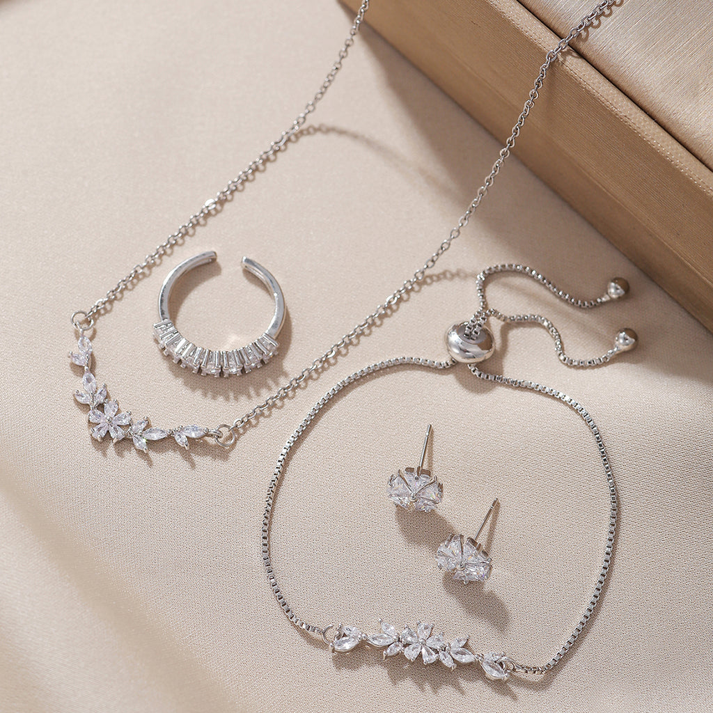 Schlichtes, elegantes Zirkon-Schmuckset, silberne Blumenkette, exquisite Ohrringe, Armband, Ring, geeignet für den täglichen Gebrauch von Frauen im Urlaub