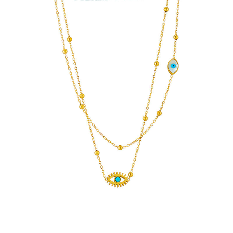 Minderheiten-Modedesign Doppellagige Mix-Kette Goldkugeln Titanstahl Tropföl Hohlblaue Augen Anhänger Halskette