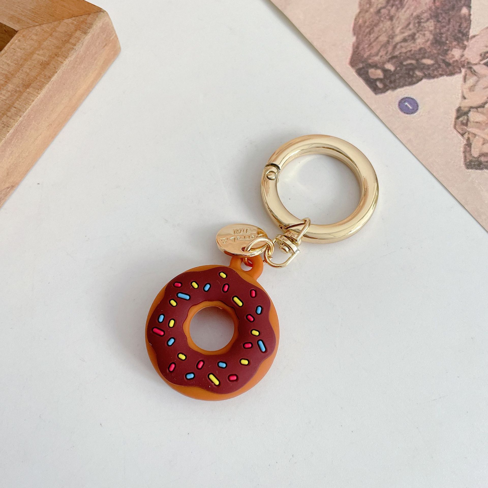 Funda protectora de silicona creativa para localizador de donas