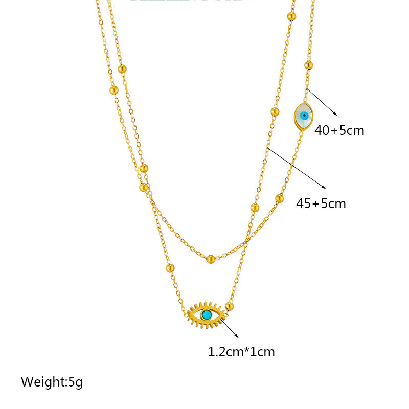 Minderheiten-Modedesign Doppellagige Mix-Kette Goldkugeln Titanstahl Tropföl Hohlblaue Augen Anhänger Halskette