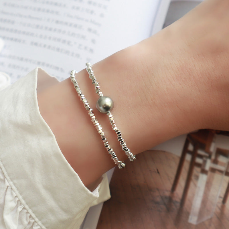 A Subtly Luxurious Niche-designed Bracelet Featuring A Few Pieces Of Silver