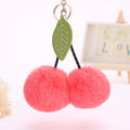 Llavero con colgante de hojas de cereza y pompón de fruta para bolso