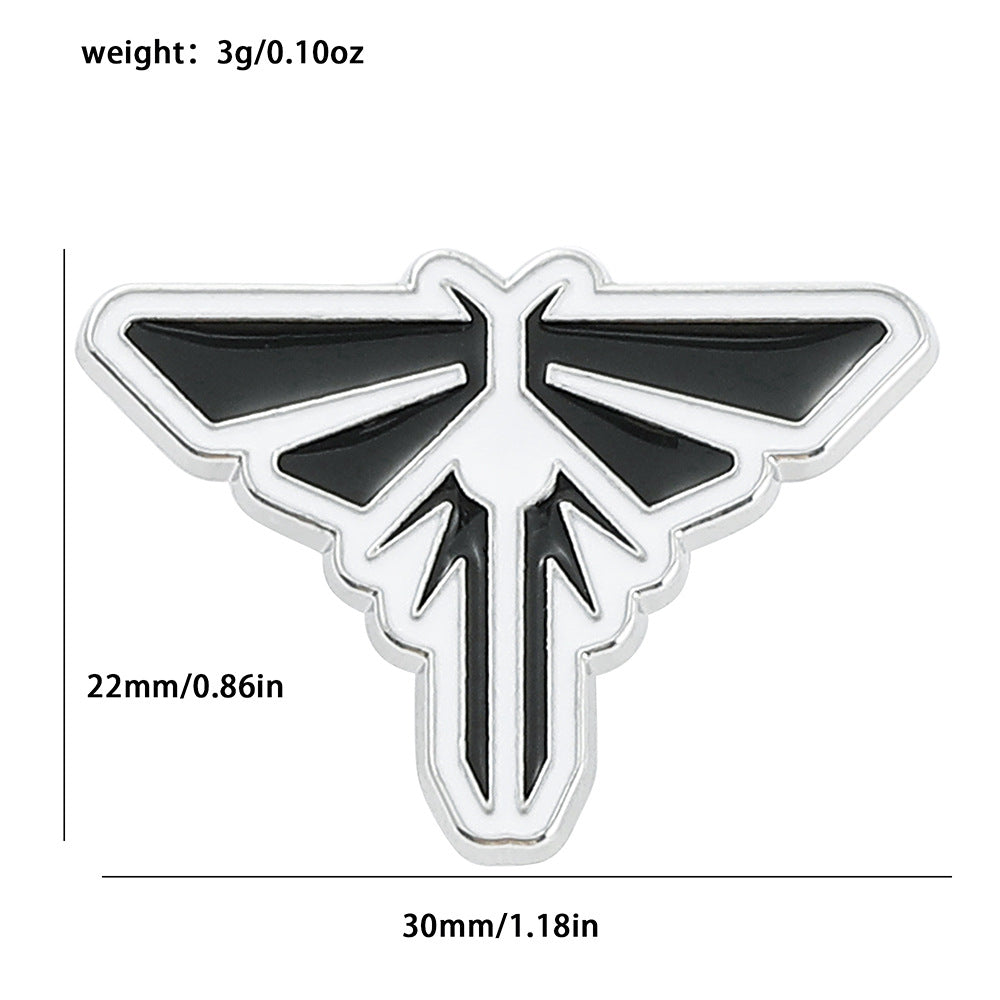 Broche de goteo de aceite con insignia M dorada