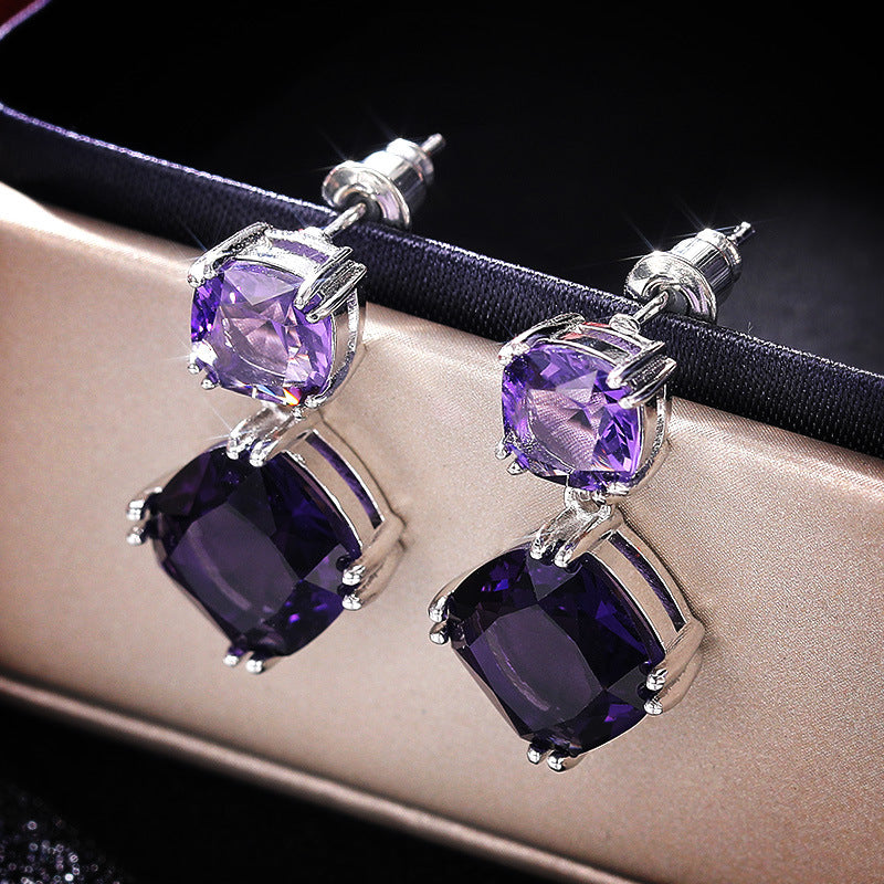 Elegantes aretes cuadrados de circonita morada misteriosa