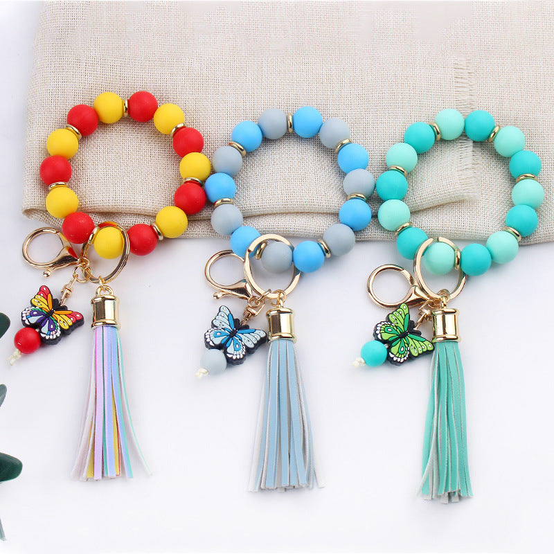Llavero de pulsera de mariposa de dibujos animados hecho a mano con cuentas, creativo