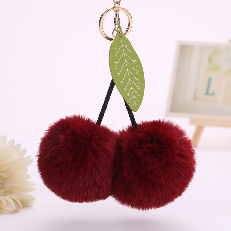 Llavero con colgante de hojas de cereza y pompón de fruta para bolso