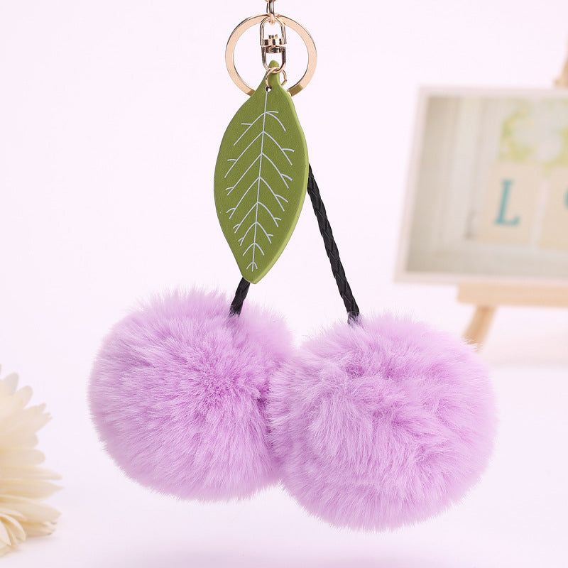 Llavero con colgante de hojas de cereza y pompón de fruta para bolso