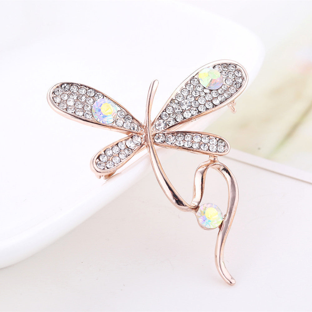 Broche de ropa de moda y elegante frasco de perfume