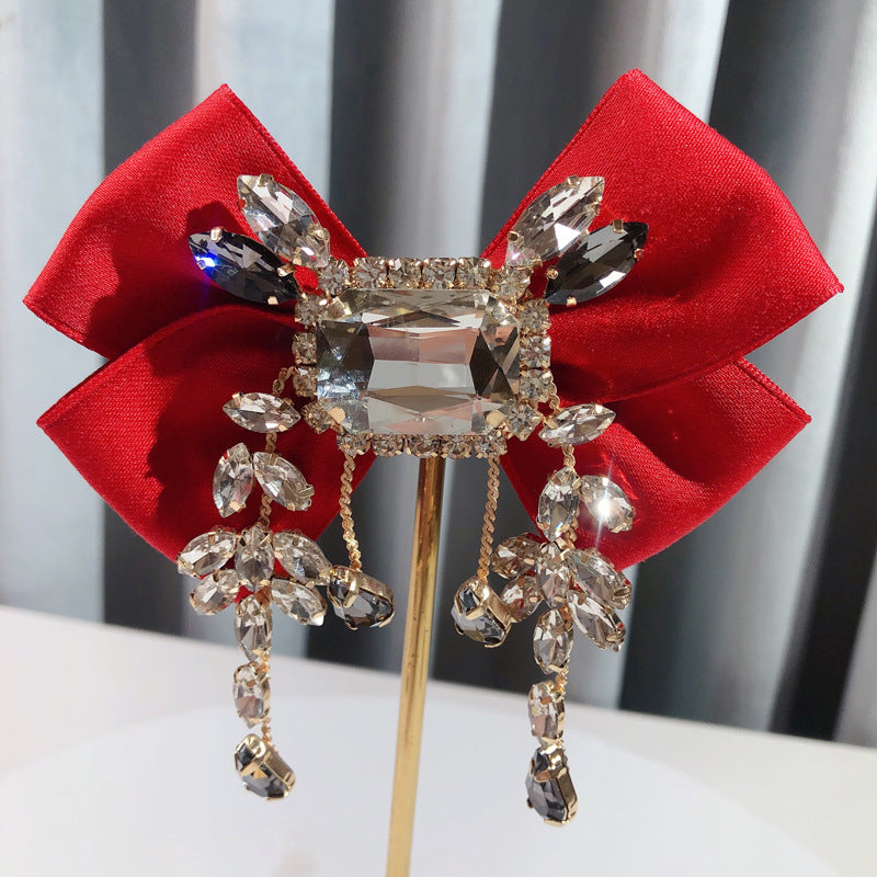 Broche de lazo británico vintage sólido de diamantes de imitación