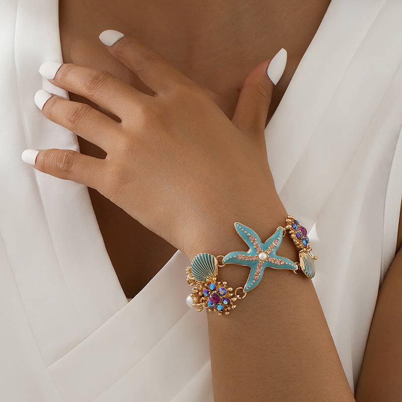 Pulsera de niña con diseño de estrellas de mar, concha y diamantes de imitación