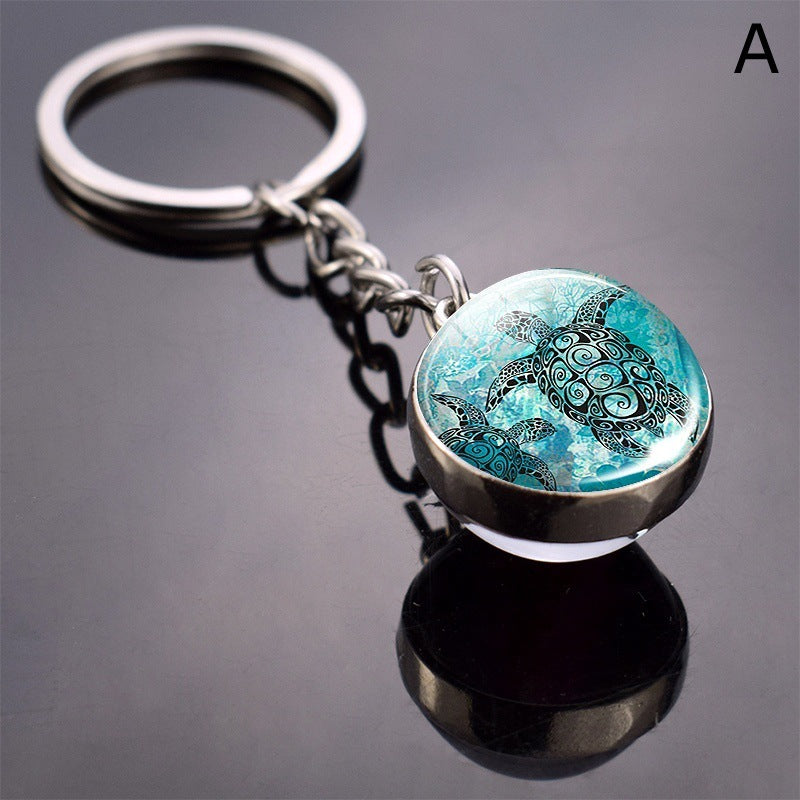 Llavero de bola de cristal con estrella de mar tortuga y animal divertido