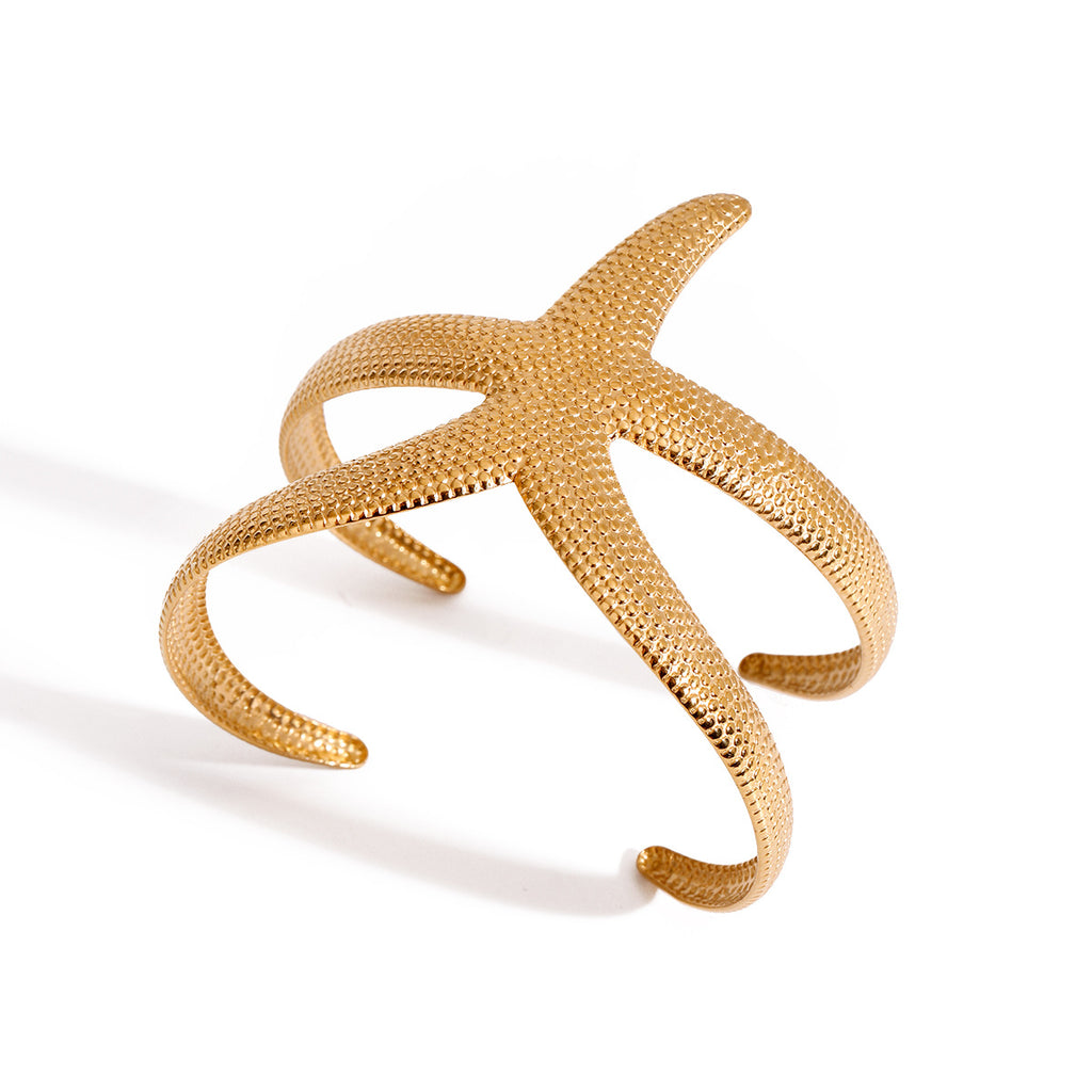Pulsera abierta de estrella de mar martillada de acero inoxidable