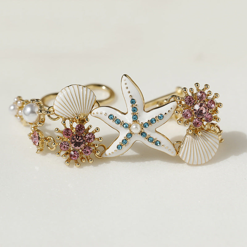 Pulsera de niña con diseño de estrellas de mar, concha y diamantes de imitación