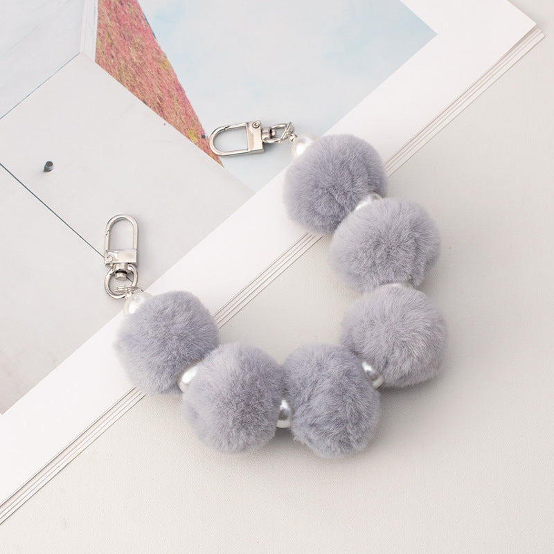 Cordón de peluche para teléfono móvil con bola de pelo