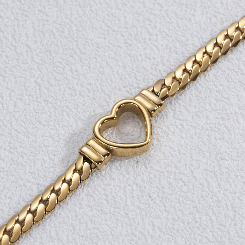 Pulsera de acero de titanio con corazón hueco, sencilla y a la moda