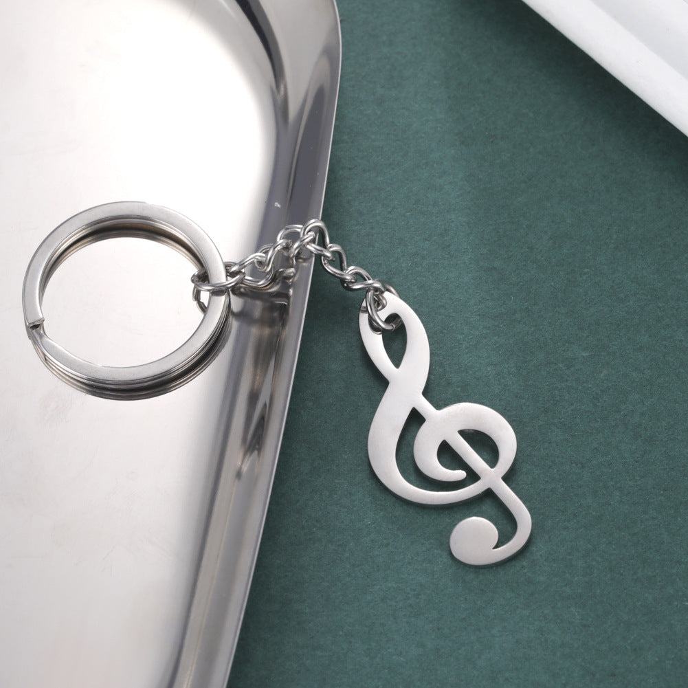 Llavero de acero inoxidable con colgante de nota musical para estudiantes de música, diseño versátil y amor por la música